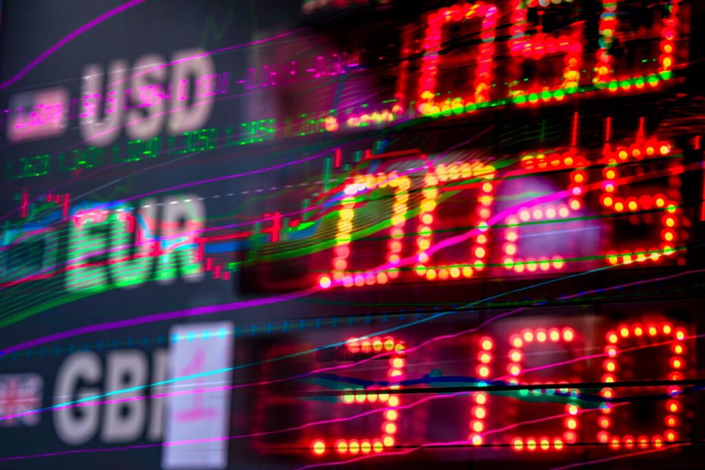 pexels-photo-12960362 Vibrant stock market display showing exchange rates for USD, EUR, and GBP. Perfect for finance themes.