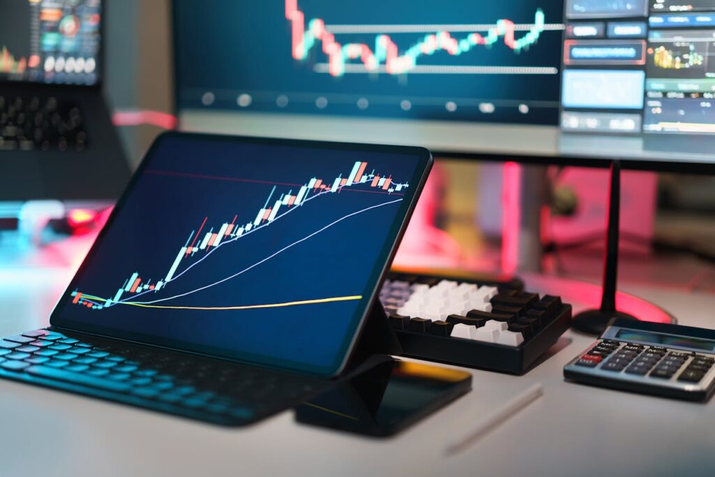 pexels-photo-30381207 A comprehensive setup featuring digital trading platforms with charts and graphs for financial analysis.